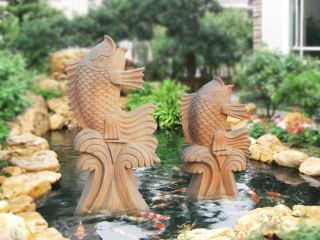 雕塑制作厂家晚霞红石雕喷水鱼